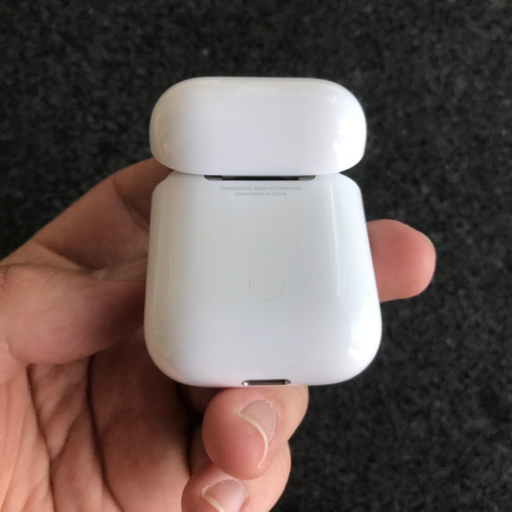 Apple AirPods charging case, pairing button
